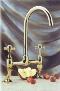 CR305G Gold pillar sink mixer with dual flow spout and traditional tap handles.