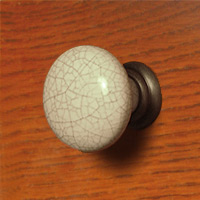 HH4013CR Ceramic Knob in 'Old Crazed' finish with a Burnished pewter mount.